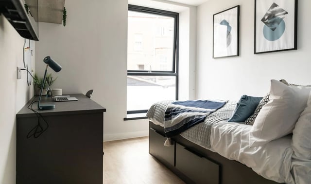 Desk with laptop and bed Bedroom at Boutique Student Living - Exeter in Exeter Student Accommodation