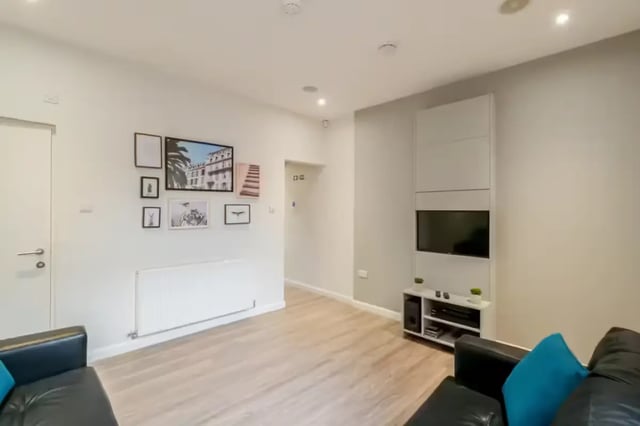 Modern living area with artwork and TV living room at 51 Beresford Street in Stoke-On-Trent Student Accommodation