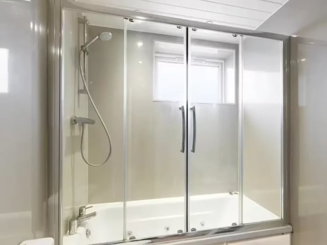 Showerhead bath tub sliding glass doors bathroom at 41 Crowther Street in Stoke-On-Trent Student Accommodation