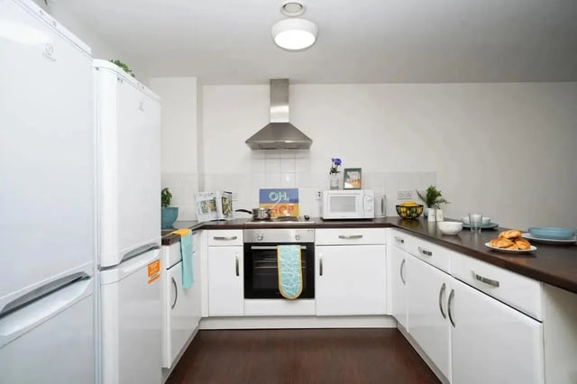 White fridges oven microwave and cabinets kitchen at Walker Street in Preston Student Accommodation