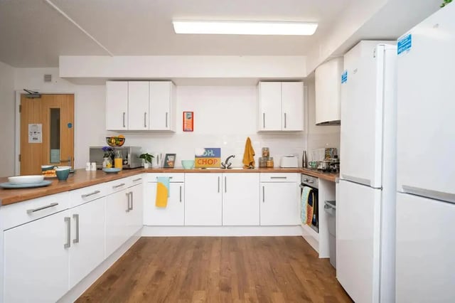 White cabinets counter two fridges kitchen at Moor Lane Halls in Preston Student Accommodation