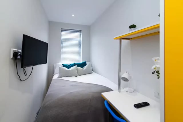 Bed TV desk lamp and remote bedroom at 38 Cauldon Road in Stoke-On-Trent Student Accommodation