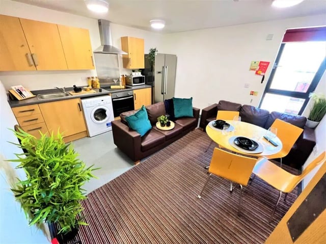 Kitchen couches table and chairs living room at Parklane House in Sunderland Student Accommodation
