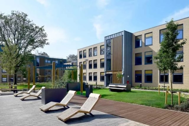 Campus buildings with lounge chairs and green spaces exterior at Luna Hatfield in Hatfield Student Accommodation
