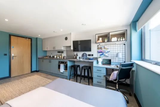 Desk kitchen area with TV study area at Luna Hatfield in Hatfield Student Accommodation