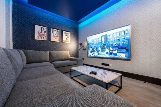 Sofa coffee table framed art large TV living room at Luna Hatfield in Hatfield Student Accommodation