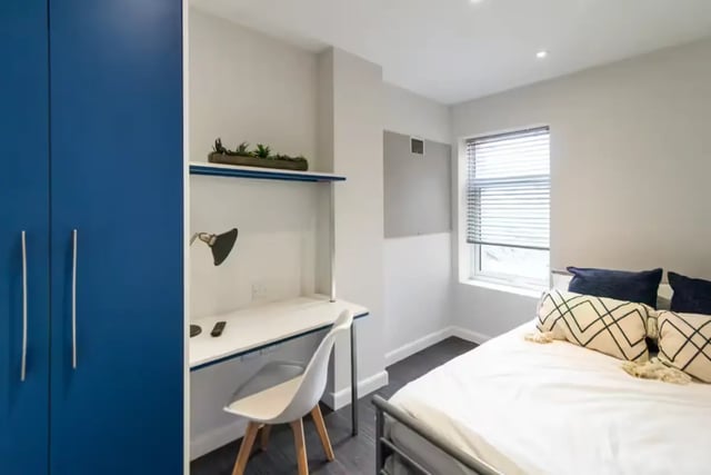 Blue wardrobe white desk chair bed bedroom at 123 Leek Road in Stoke-On-Trent Student Accommodation