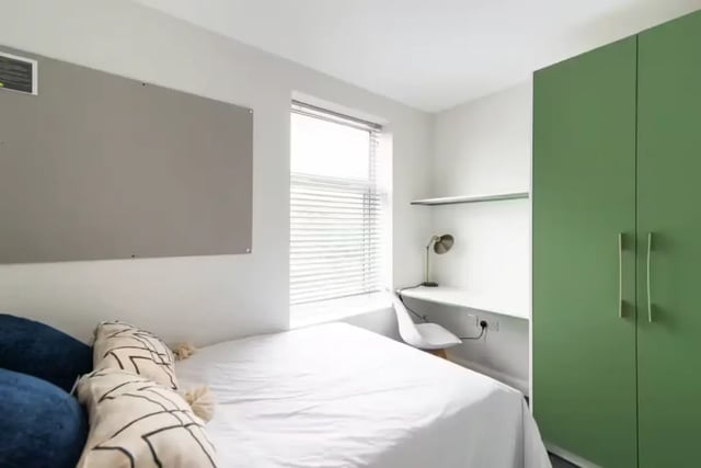 Bed desk and green wardrobe student bedroom at 123 Leek Road in Stoke-On-Trent Student Accommodation