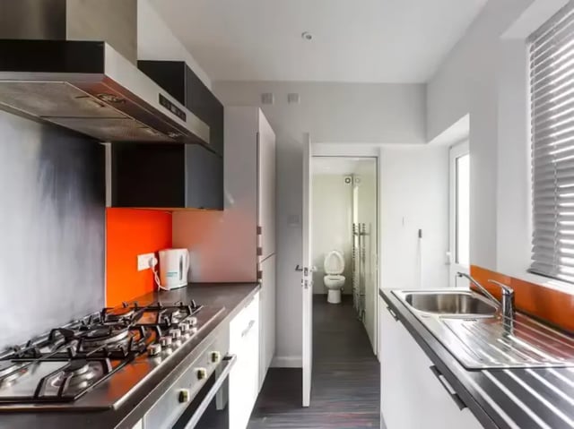 Kitchen with oven sink and bathroom view Kitchen at 86 Beresford Street in Stoke-On-Trent Student Accommodation
