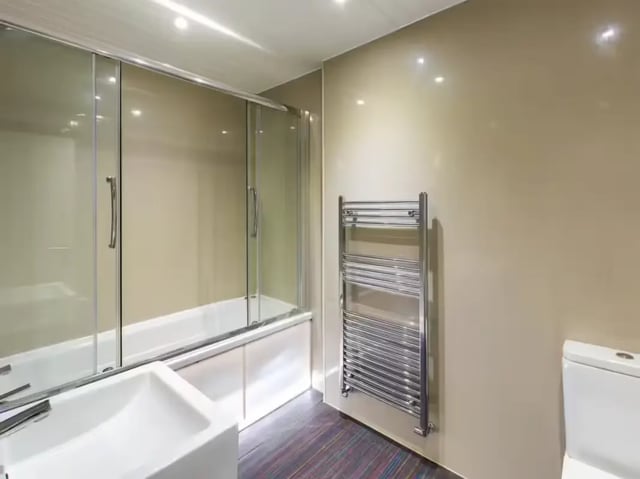 Sink bathtub glass shower heated towel rail bathroom at 86 Beresford Street in Stoke-On-Trent Student Accommodation