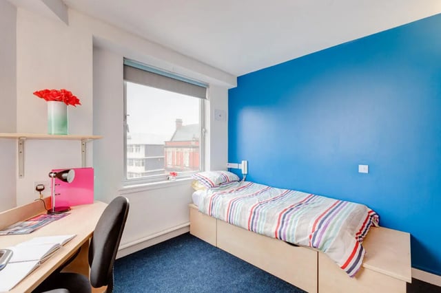 Desk lamp pink folder flowers striped bed bedroom at Dunn House in Sunderland Student Accommodation