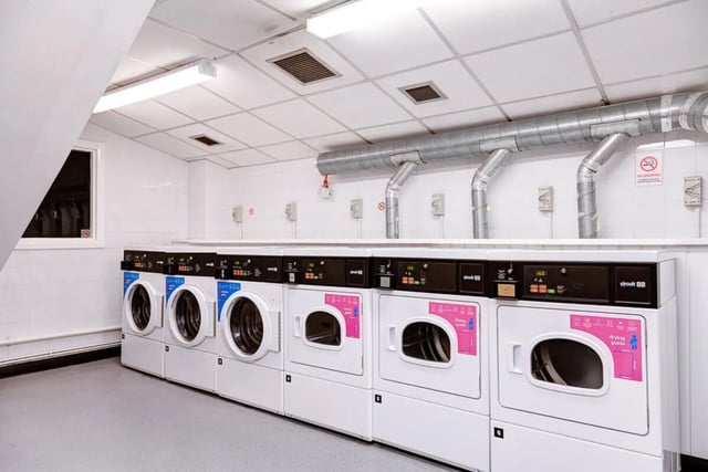 Row of washing and drying machines utility area at Dunn House in Sunderland Student Accommodation