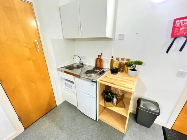 Compact kitchen with sink hob fridge microwave kitchen at Dunn House in Sunderland Student Accommodation