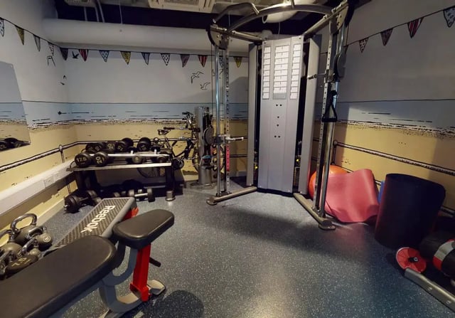 Weights machine dumbbells bench and bicycle gym at iQ Bristol in Bristol Student Accommodation