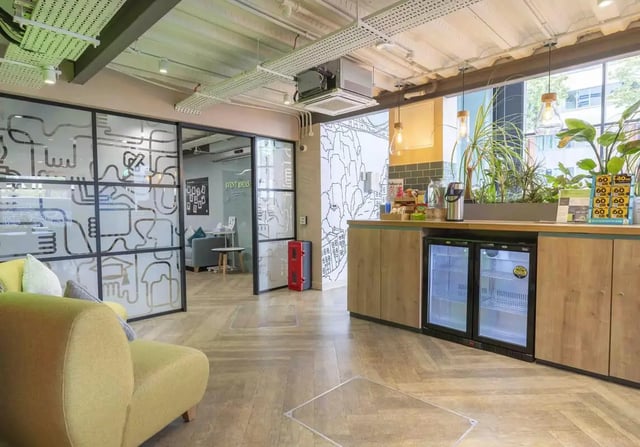 Sofa fridges plants and counter communal area at iQ Bristol in Bristol Student Accommodation