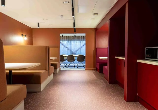 Booths and microwave in common area. at iQ Leeds in Leeds Student Accommodation