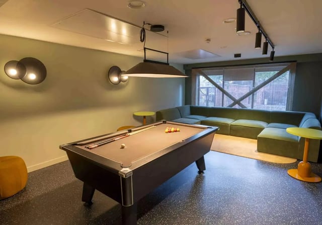 Pool table sectional sofa playing area at iQ Leeds in Leeds Student Accommodation