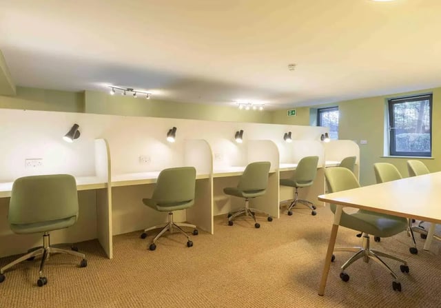 Desks with chairs and lights study area at iQ Leeds in Leeds Student Accommodation
