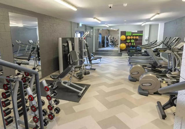 Dumbbells treadmills machines and exercise equipment gym at iQ Leeds in Leeds Student Accommodation