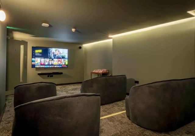 Dark grey beanbags television screen and soundbar living room at iQ Kingston in Kingston Upon Thames Student Accommodation