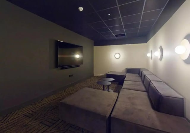 Lounge with sectional sofa television and tables Living room at iQ Hoxton in London Student Accommodation