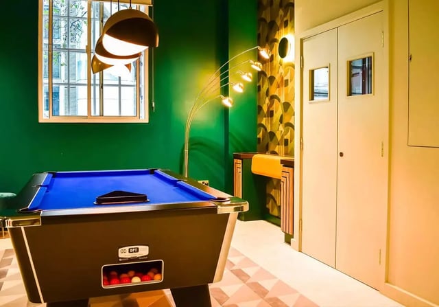 Pool table with blue felt and billiard balls game room at iQ Bloomsbury in London Student Accommodation