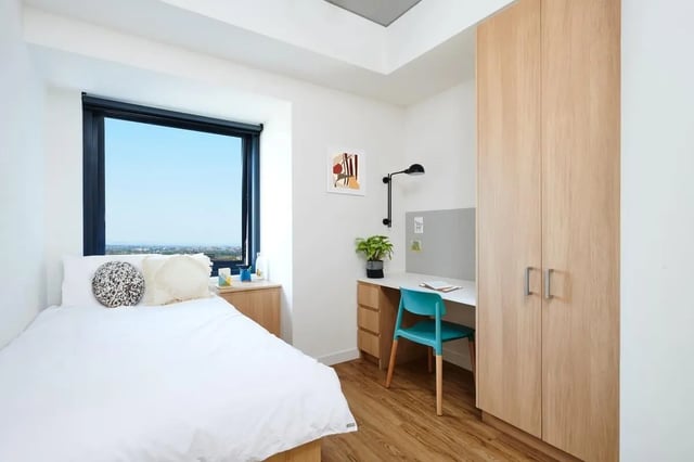 Bed desk wardrobe and window bedroom at Scape Uni Square in Melbourne Student Accommodation