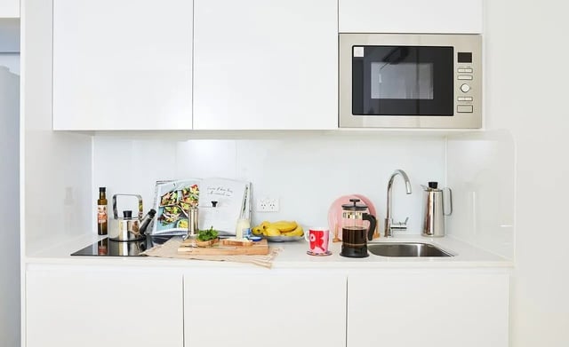Microwave kettle fruit and coffee maker kitchen at Scape Franklin in Melbourne Student Accommodation