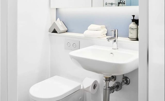 Toilet sink towels tissue dispenser bathroom at Scape Franklin in Melbourne Student Accommodation