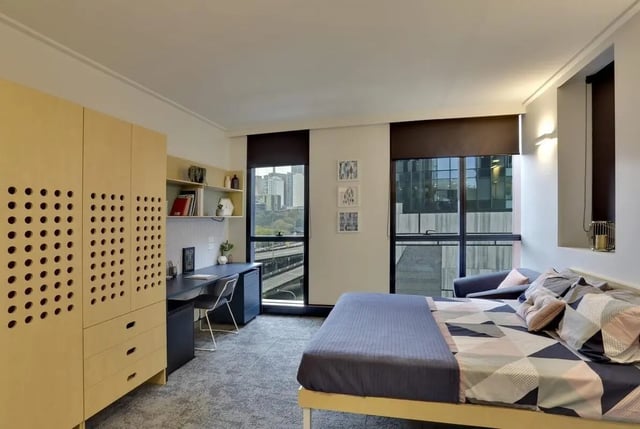 Bed desk wardrobe and shelves bedroom at Scape Darling House in Sydney Student Accommodation
