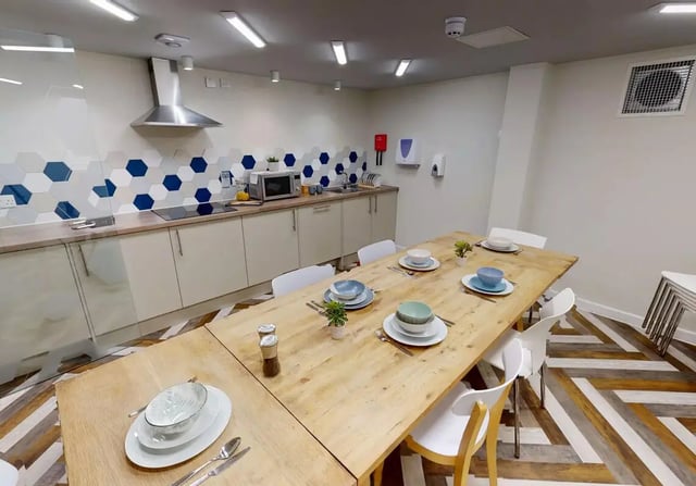 Dining table with place settings kitchen interior at iQ Brocco in Sheffield Student Accommodation