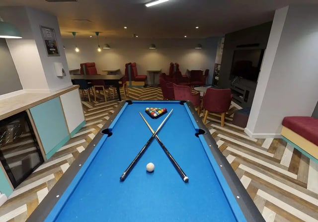Pool table cues balls and seating area communal area at iQ Brocco in Sheffield Student Accommodation