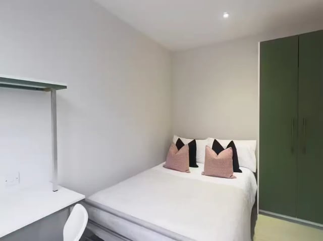 Bed desk pillows green wardrobe bedroom at 31 Guildford Street in Stoke-On-Trent Student Accommodation