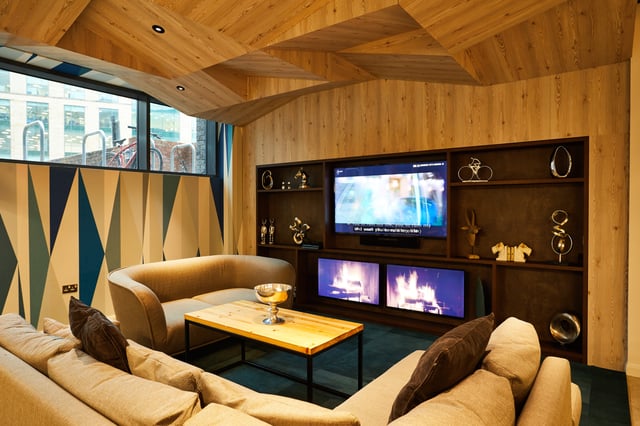Modern living room with sectional sofas and entertainment system living room at Vita Student Newcastle Strawberry Place in Newcastle Upon Tyne Student Accommodation