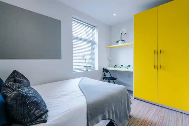 Bed desk and yellow wardrobe bedroom at 90 Ashford Street in Stoke-On-Trent Student Accommodation