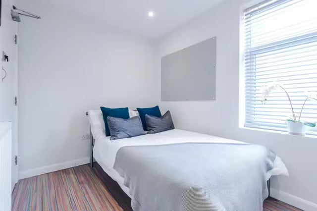 Bed with pillows whiteboard and window bedroom at 90 Ashford Street in Stoke-On-Trent Student Accommodation
