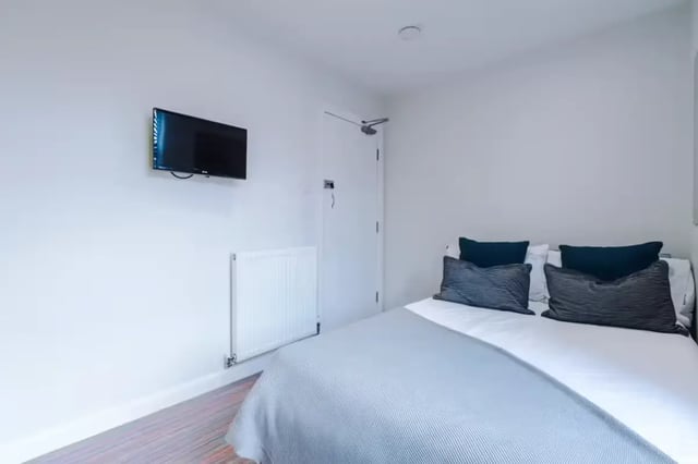 Bed with pillows radiator mounted TV bedroom at 90 Ashford Street in Stoke-On-Trent Student Accommodation