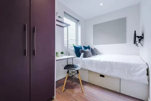 Closet bed desk chair with pillows bedroom at 90 Ashford Street in Stoke-On-Trent Student Accommodation