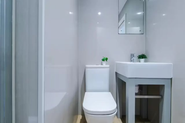 Modern bathroom with toilet sink and shower at 90 Ashford Street in Stoke-On-Trent Student Accommodation