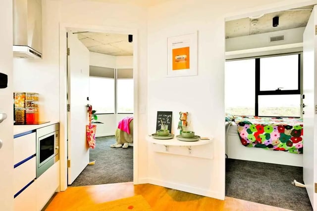 Kitchen counters microwave storage jars two bedrooms. at Scape Kingsford in Sydney Student Accommodation
