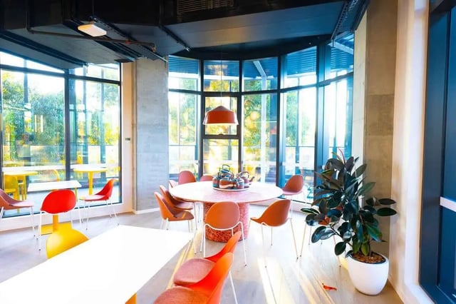 Tables chairs plant and kettles dining area at Scape Kingsford in Sydney Student Accommodation