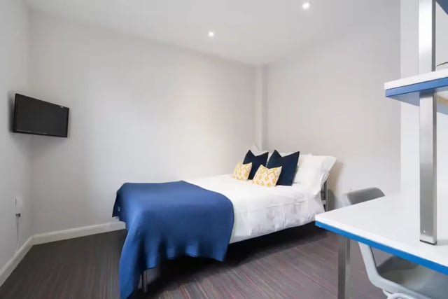Bed desk TV on wall bedroom at 16 Queen Anne Street in Stoke-On-Trent Student Accommodation