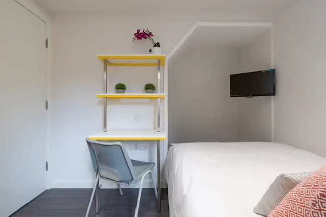 Desk chair shelves and bed with TV bedroom at 16 Queen Anne Street in Stoke-On-Trent Student Accommodation
