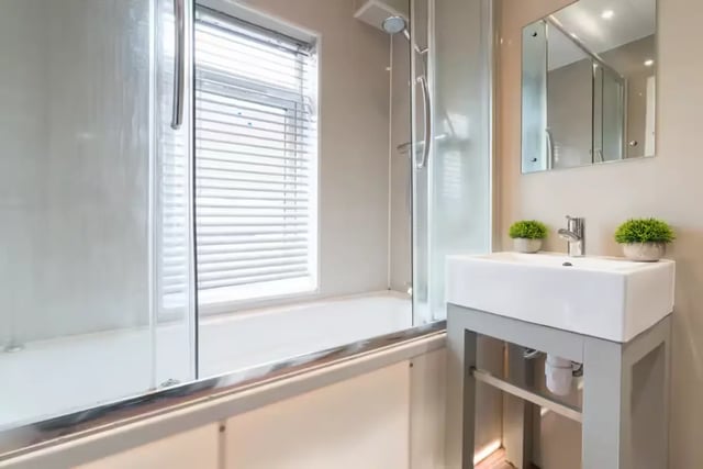 Sink shower tub window mirror plants bathroom at 16 Queen Anne Street in Stoke-On-Trent Student Accommodation
