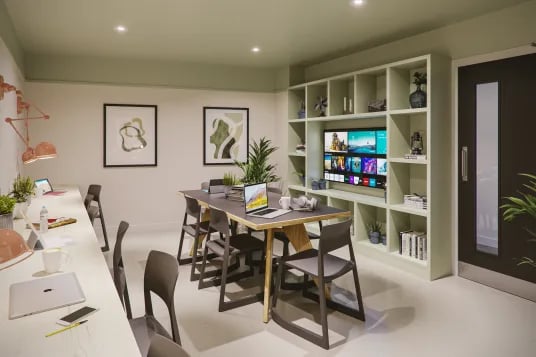 Desks chairs table TV shelves study area at Briggate Studios in Leeds Student Accommodation