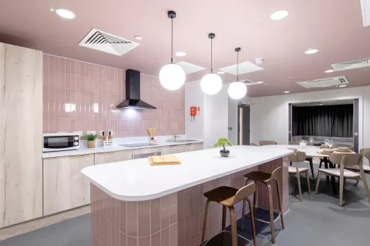 Kitchen with island dining table and seating kitchen at Briggate Studios in Leeds Student Accommodation