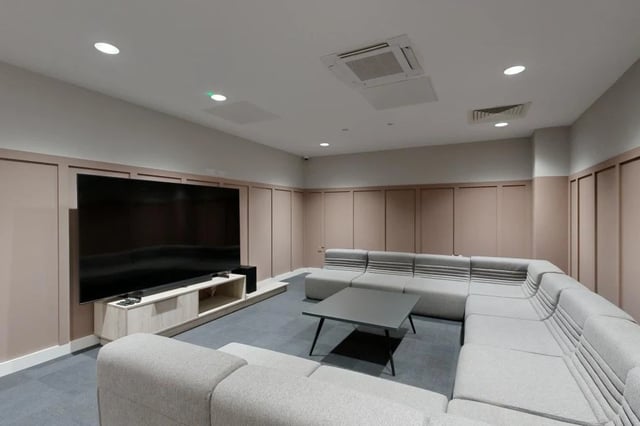 Large TV sectional couch coffee table common area at Briggate Studios in Leeds Student Accommodation