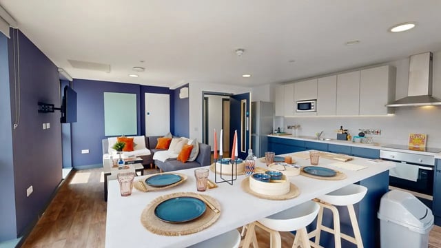 Sofa kitchen island and TV living kitchen at Tribeka in Leeds Student Accommodation