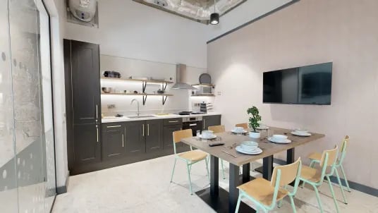 Kitchen and dining area with table and chairs at Tribeka in Leeds Student Accommodation