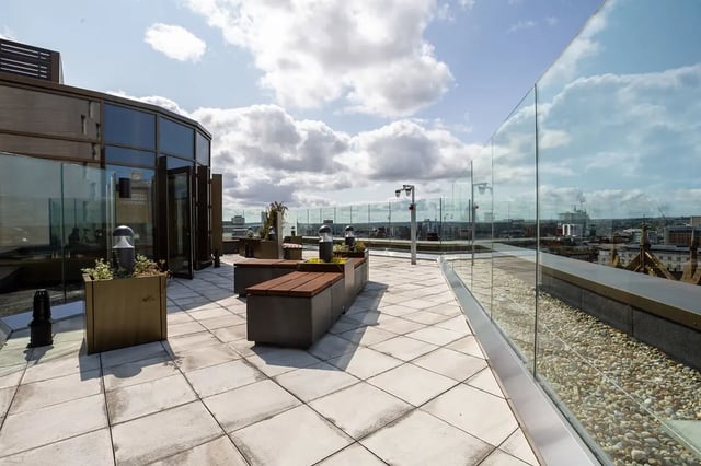 Seating benches glass railing city view exterior at Tribeka in Leeds Student Accommodation